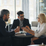 A client consulting with an appellate law firm in a meeting room to evaluate their options for a court appeal.
