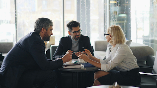 A client consulting with an appellate law firm in a meeting room to evaluate their options for a court appeal.